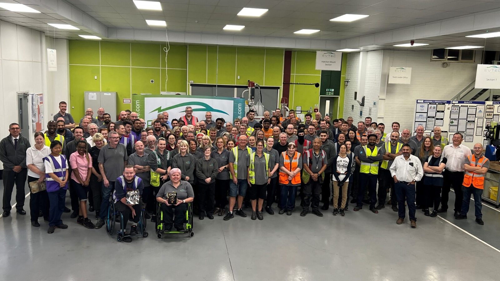 The full Evtec workforce gathered for a group photograph on the shop floor